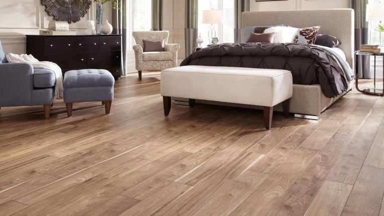 warm wood look laminate floors in a contemporary bedroom